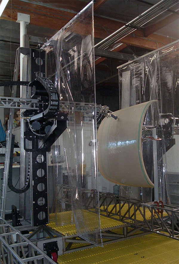 SDI-5740 vertical frame through-transmission 3D scanning ultrasonic system inspecting a cone-shaped composite part